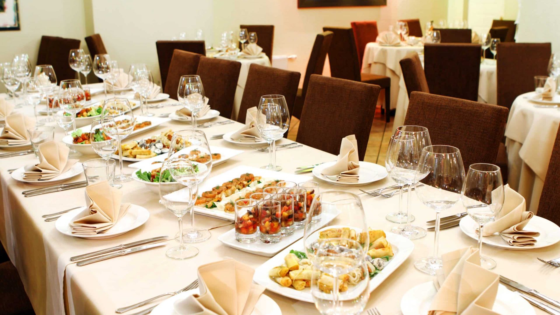 Banquet table with restaurant serving and snacks